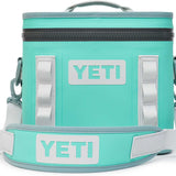 Yeti Hopper Flip 8 Personal Cooler - A mint green cooler with a zippered top and two handles, one on each side.