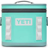 Yeti Hopper Flip 8 Personal Cooler - A mint green cooler with a zippered top and two white handles on either side.