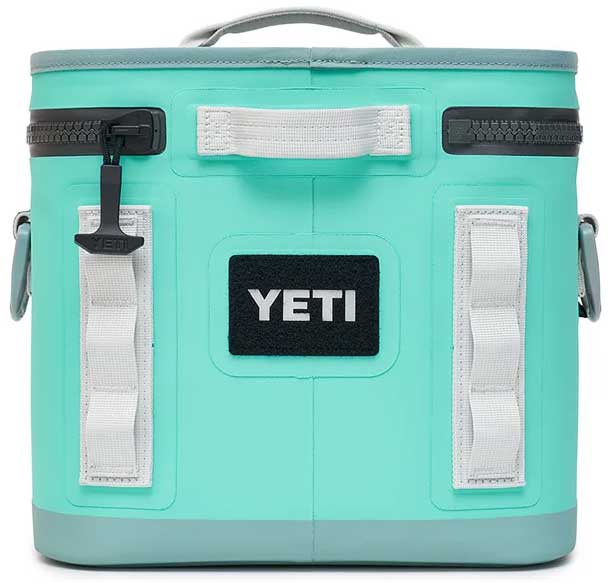 Yeti Hopper Flip 8 Personal Cooler - A mint green cooler with a handle on top and two zippered compartments, one in front and one on the side.