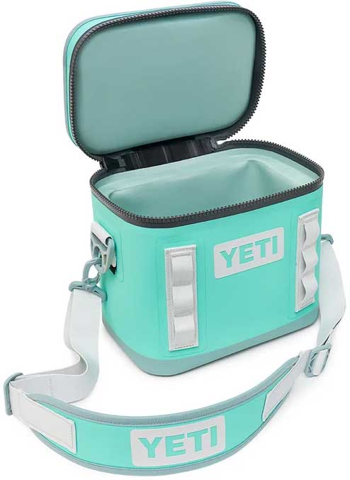 Yeti Hopper Flip 8 Personal Cooler - A mint green cooler with a zippered lid and two handles on either side, featuring a white logo that reads "YETI" in block letters.