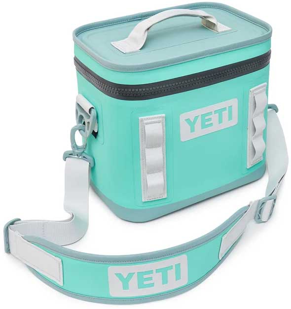Yeti Hopper Flip 8 Personal Cooler - A mint green cooler with a zippered lid and two handles, featuring a white logo on the front.