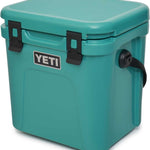 Yeti Roadie 24 Hard Cooler - A compact, portable cooler with a stainless steel handle and rubberized grip on top.