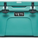 Yeti Tundra 35 Hard Cooler - A large, rectangular cooler with a dark gray lid and matching body, featuring a handle on top and a logo in silver lettering.