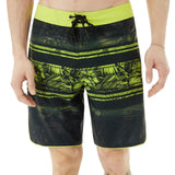 Oakley Men's Temples 19" Swim Board Shorts 2018 - Black swim trunks with a palm tree pattern and lime green accents.