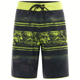 Oakley Men's Temples 19" Swim Board Shorts 2018 - Black swim trunks with a palm tree pattern and lime green accents.