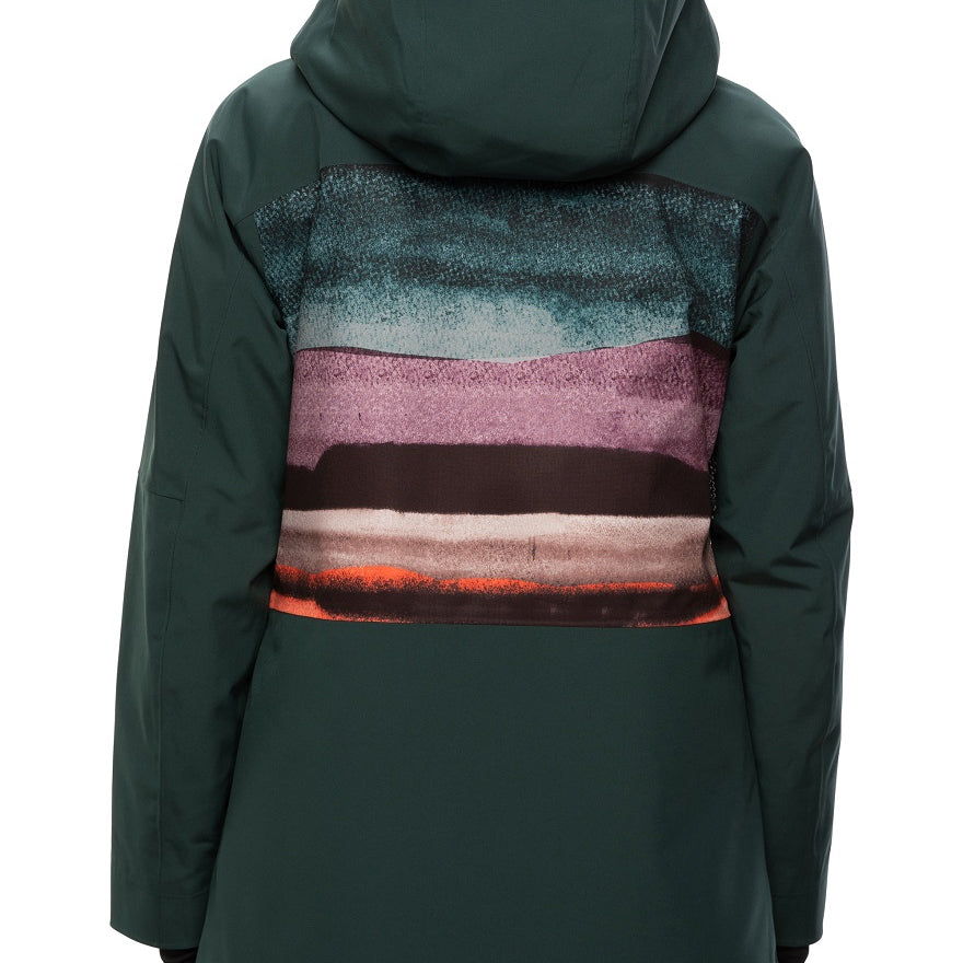 The 686 brand Lady's Glacier Crust Mantra Insulated Jacket 2021 has a dark green color with an abstract design on the back in shades of blue, purple and pink.
