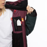 The 686 Ladies GLCR Mantra Insulated Jacket 2021 is plum-colored with a black BOA dial and an insulated hood.