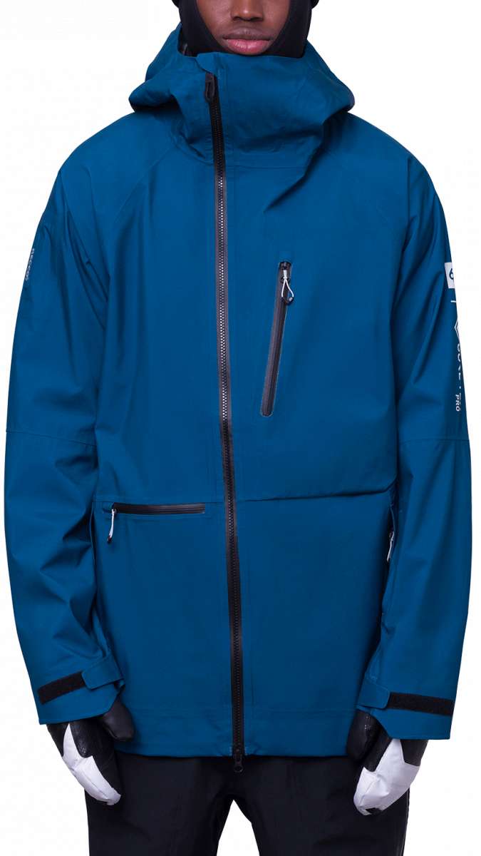 The 686 3L GORE-TEX Hydra Thermagraph Jacket 2024 is shown in a blue color with an insulated hood.