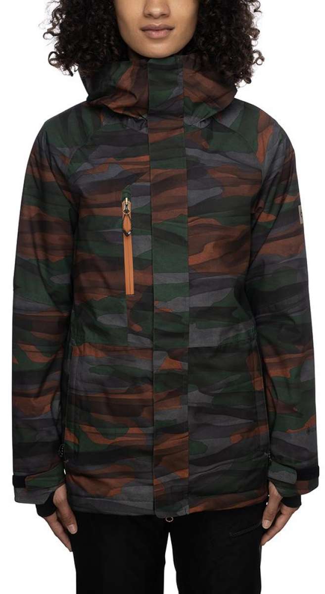 The 686 Women's Willow Gore-Tex Insulated Jacket is showcased in a front view with a camouflage pattern of green, brown, and gray hues.