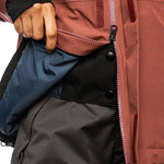 The 686 Ladies GLCR GORE-TEX Willow Insulated Jacket 2022 is primarily a muted red jacket with black accents and a black zipper down the front.