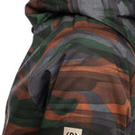 The 686 Ladies GLCR GORE-TEX Willow Insulated Jacket 2022 features an orange and green camouflage pattern with a hood.