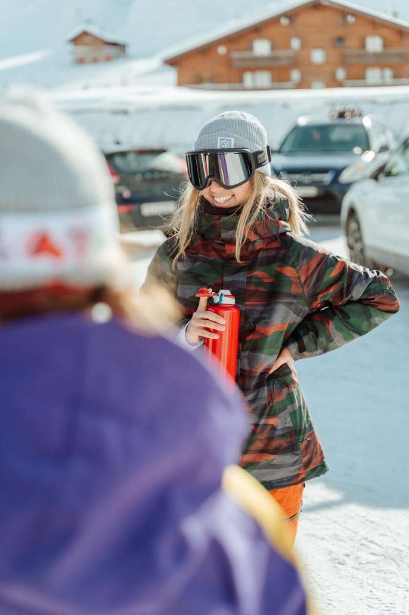 The 686 brand's women's Willow jacket boasts a camouflage pattern in shades of green and orange.