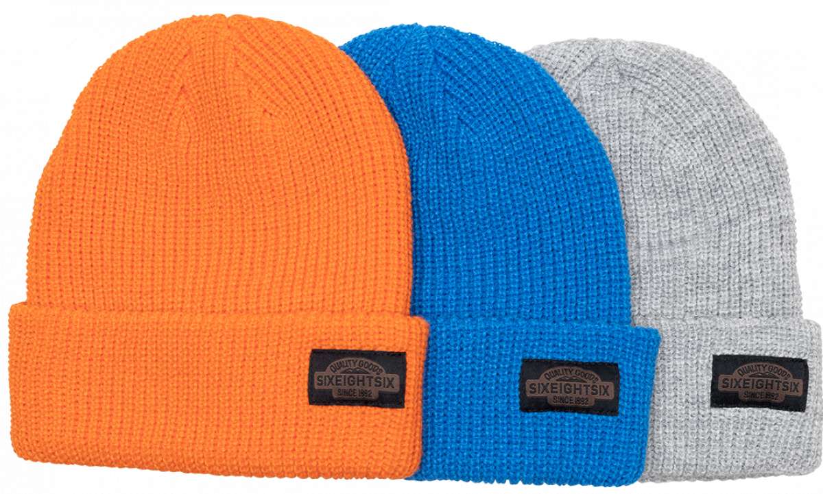 The 686 Classic Knit 3-Pack Beanie in orange, blue, and grey appears to be made from a thick knit material.