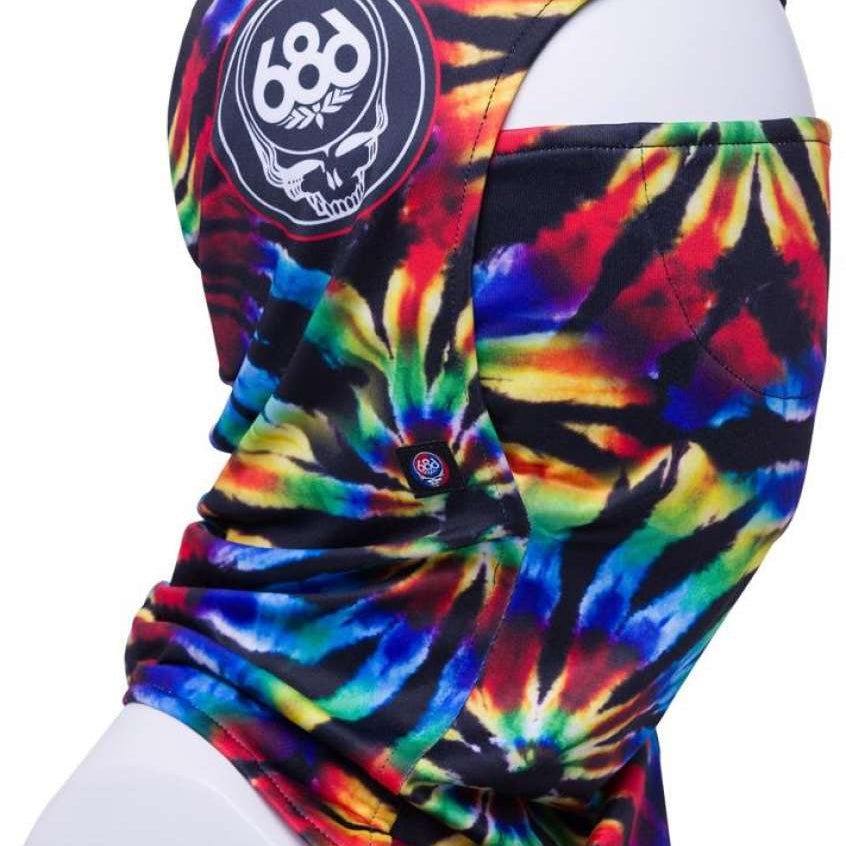 The 686 Deluxe Hinged Balaclava 2024 has a black background with a tie-dye pattern of red, yellow, green, blue, and purple colors.