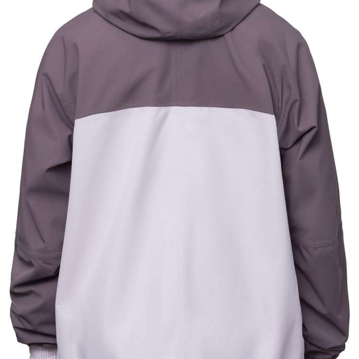 The 686 Dojo Shell Jacket 2024 in this front view has a predominantly gray color scheme with a white panel across the middle and a black hood.