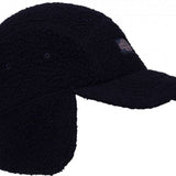 The 686 Fleece Camper Hat 2024 is black with a faux fur exterior and a large faux fur pom-pom on top.