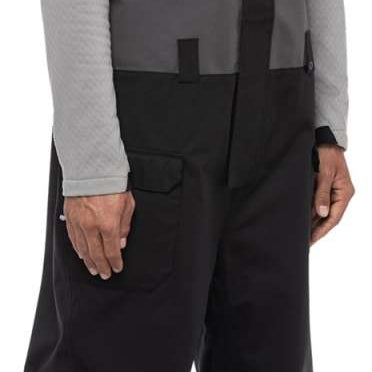 The 686 Frontier Shell Bib 2024 is predominantly black with white accents and has multiple pockets.