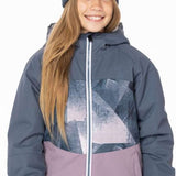 A young girl with long blonde hair wearing the 686 brand Athena insulated jacket in blue-grey and dusty pink, showcasing a front view.