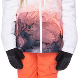 The 686 Girls Hydra Insulated Jacket 2023 is predominantly white with an abstract pink and black design on the bottom portion of the jacket.