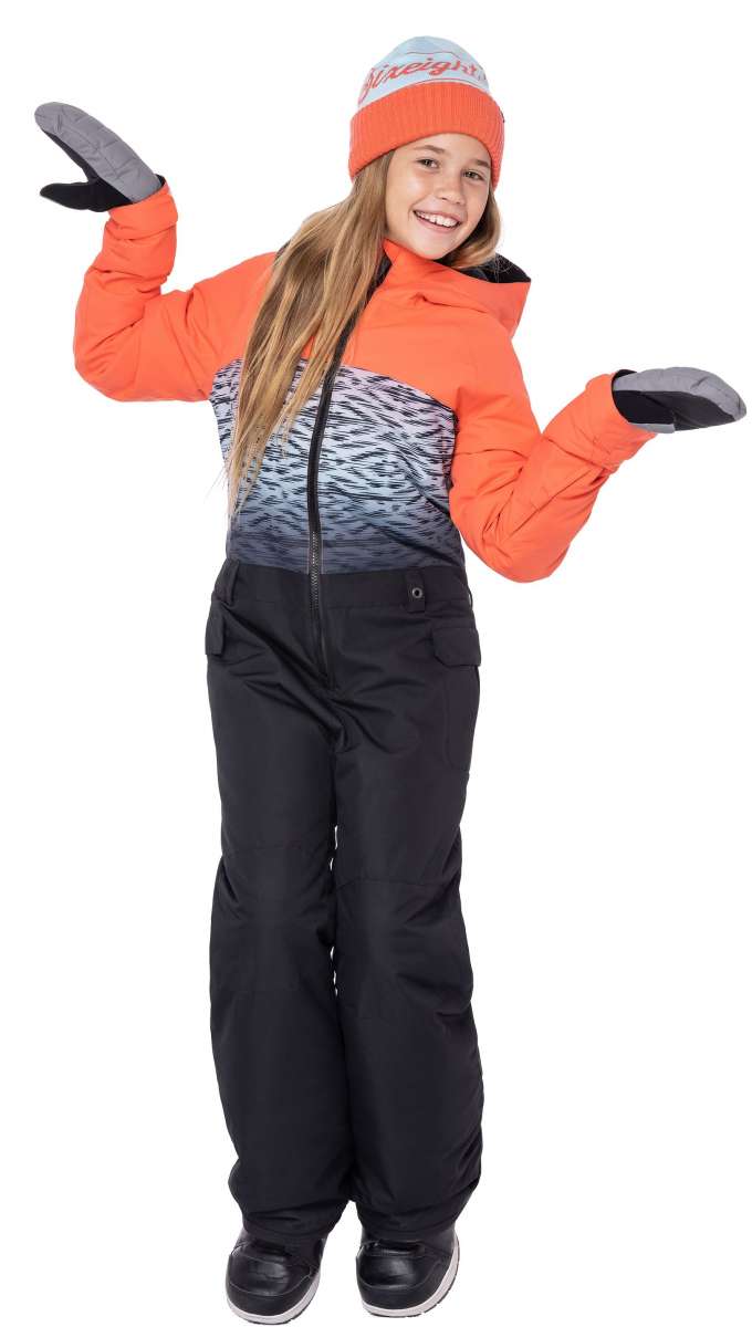 The 686 Girls Shine Insulated One-Piece Snowsuit is black with an abstract white and grey pattern on top, accented by bright orange cuffs, collar, and zipper.