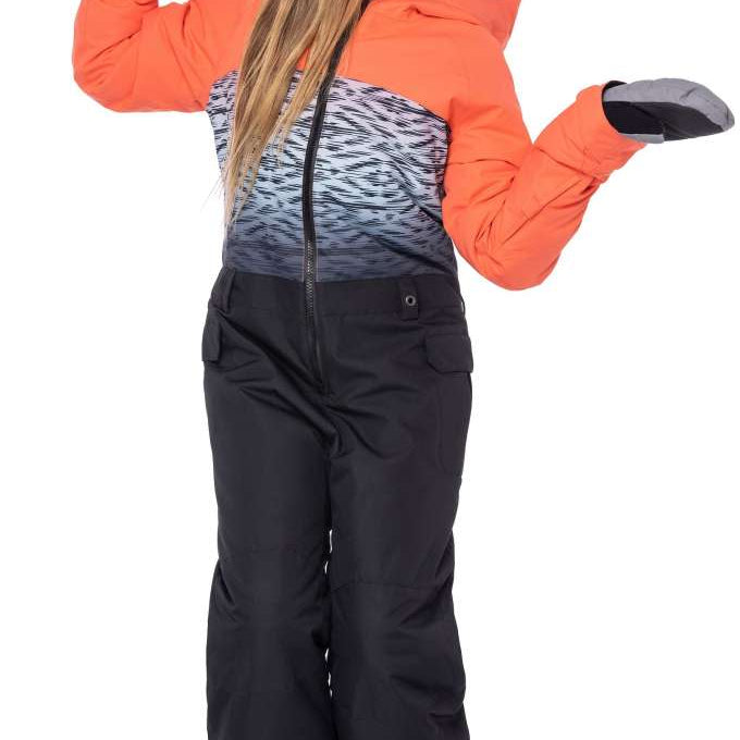 The 686 Girls Shine Insulated One-Piece Snowsuit is black with an abstract white and grey pattern on top, accented by bright orange cuffs, collar, and zipper.