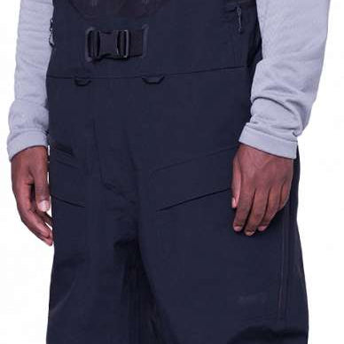 The 686 Gore-Tex Pro 3L Thermagraph Bib Pants in black have a zippered leg pocket and adjustable straps.
