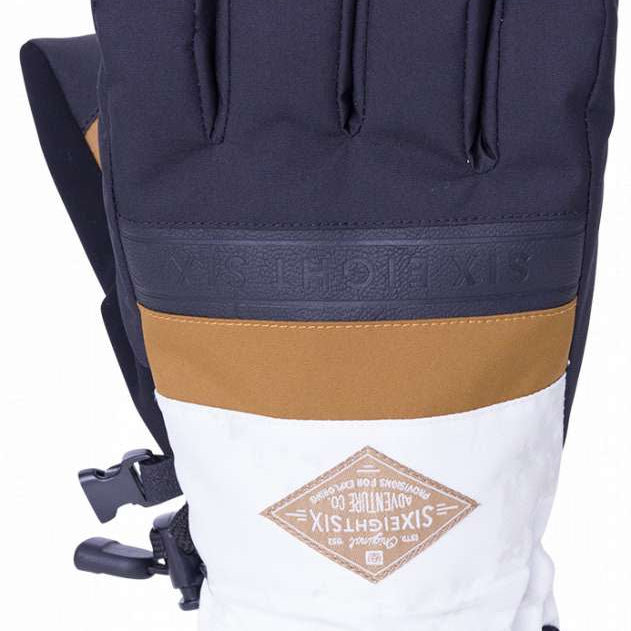 The 686 Infiloft Recon Gloves 2024 appear to be dark blue with a tan band at the wrist and black accents.