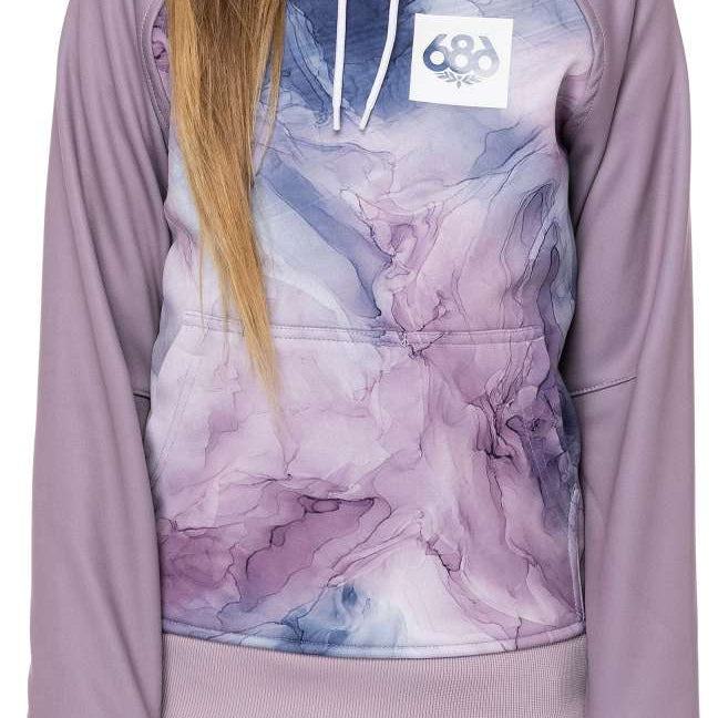 A young girl with long blonde hair wearing a purple and grey 686 hoodie with an insulated hood, smiling at the camera.