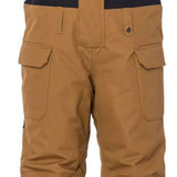 The 686 Junior Frontier Insulated Bib 2023 is brown with a black logo on the left leg and has an adjustable waist strap.