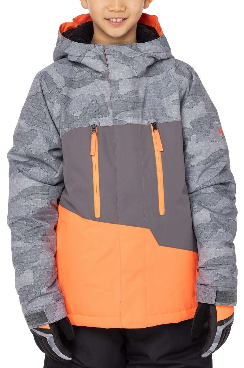 The 686 Junior Geo Insulated Jacket 2023 is predominantly gray with an orange lower section and has a camouflage pattern on the upper body.
