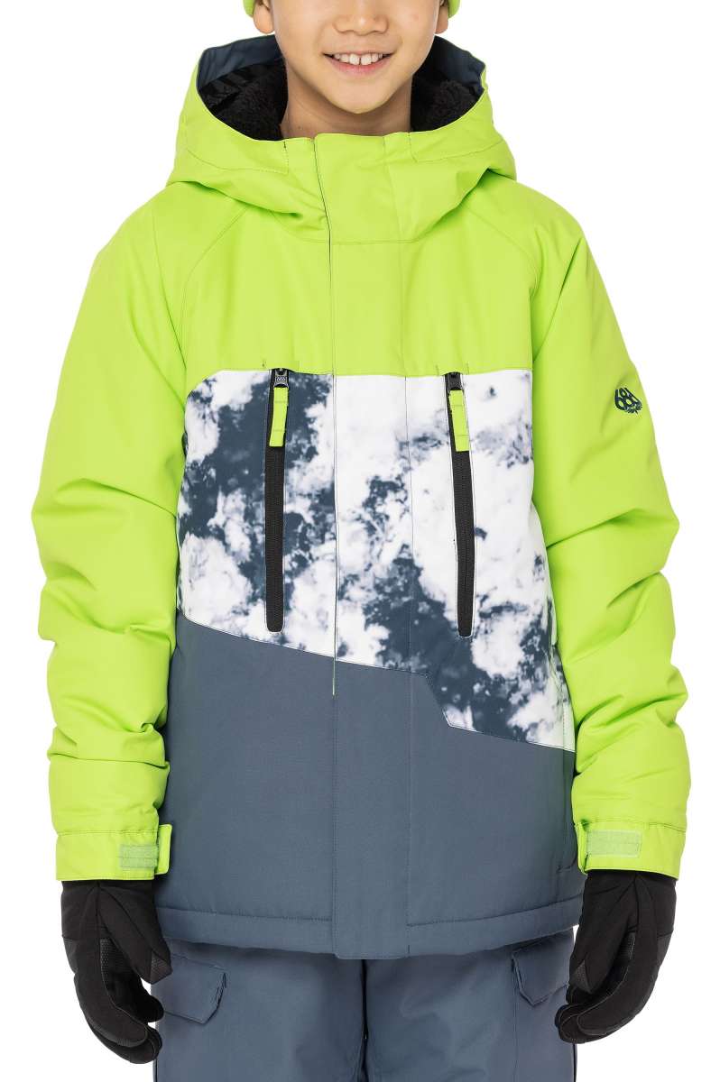 The 686 Junior Geo Insulated Jacket 2023 is predominantly lime green with a gray and white snow pattern on the front, featuring a black zipper and two vertical black zippers with lime green tabs.