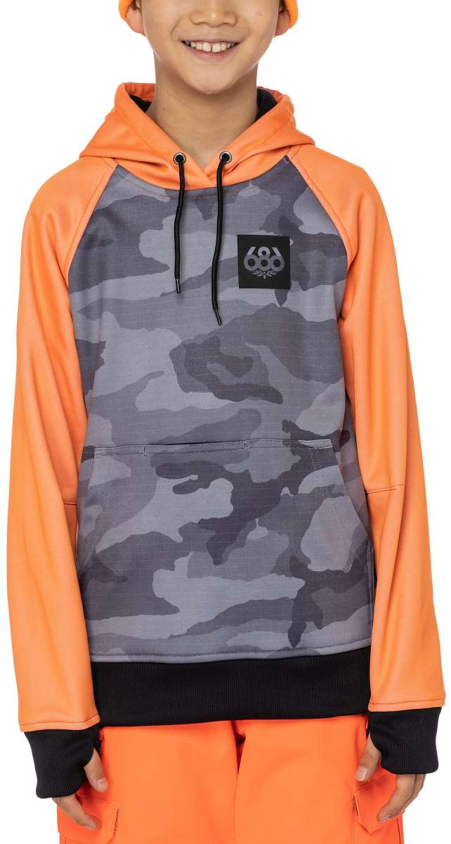 The 686 Juniors Bonded Fleece Pullover Hoodie 2023 features a grey camouflage pattern with orange sleeves and an insulated hood.