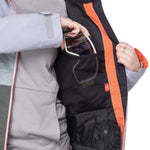 The 686 Women's Athena Insulated Jacket 2022 is predominantly black with orange accents along the zipper and down the side.