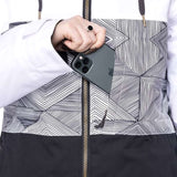 The 686 Women's Athena Insulated Jacket 2022 is predominantly white with black accents and features an abstract line pattern on the front.