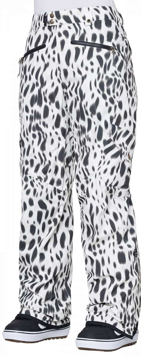 The 686 Women's Aura Insulated Cargo Pant 2024 has a white base color with black spots and features multiple zippered pockets on both sides.