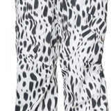 The 686 Women's Aura Insulated Cargo Pant 2024 has a white base color with black spots and features multiple zippered pockets on both sides.