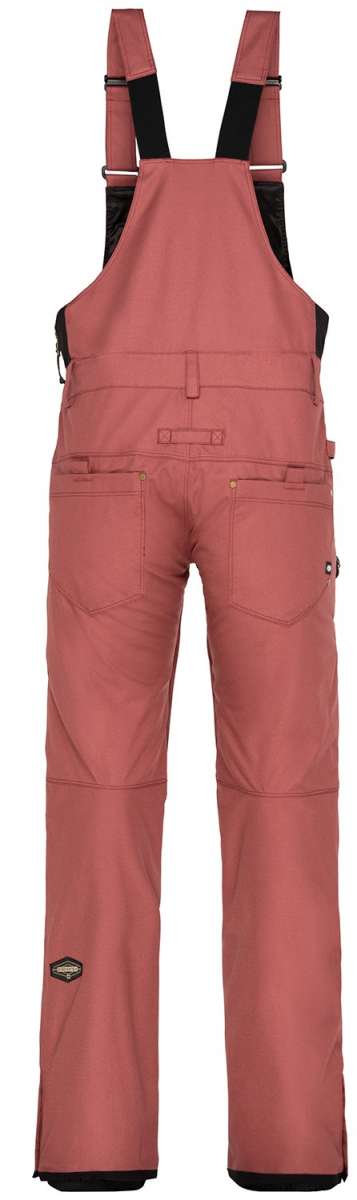 The 686 Black Magic bibs are showcased in a black color with a quilted pattern on the front and back.