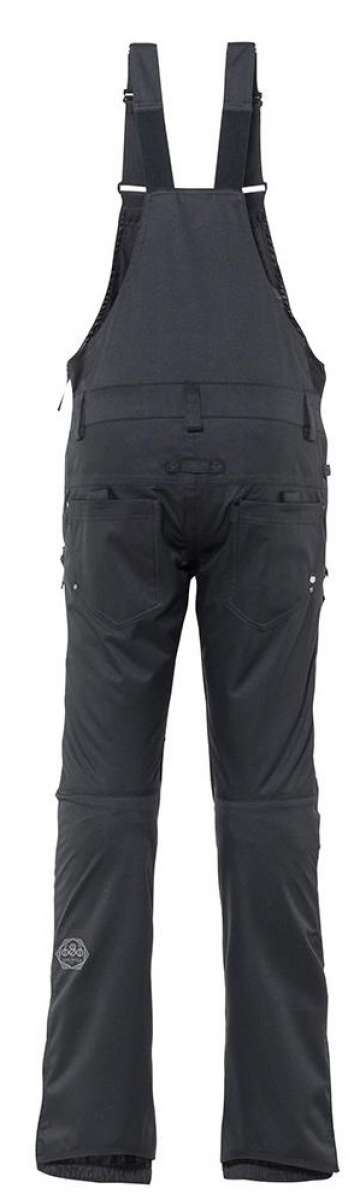 The 686 Ladies Black Magic Insulated Bib features a sleek black color with white accents and side zippered pockets.