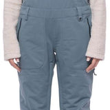 The 686 Ladies Black Magic Insulated Bib features black fabric with a drawstring waist and adjustable leg straps.