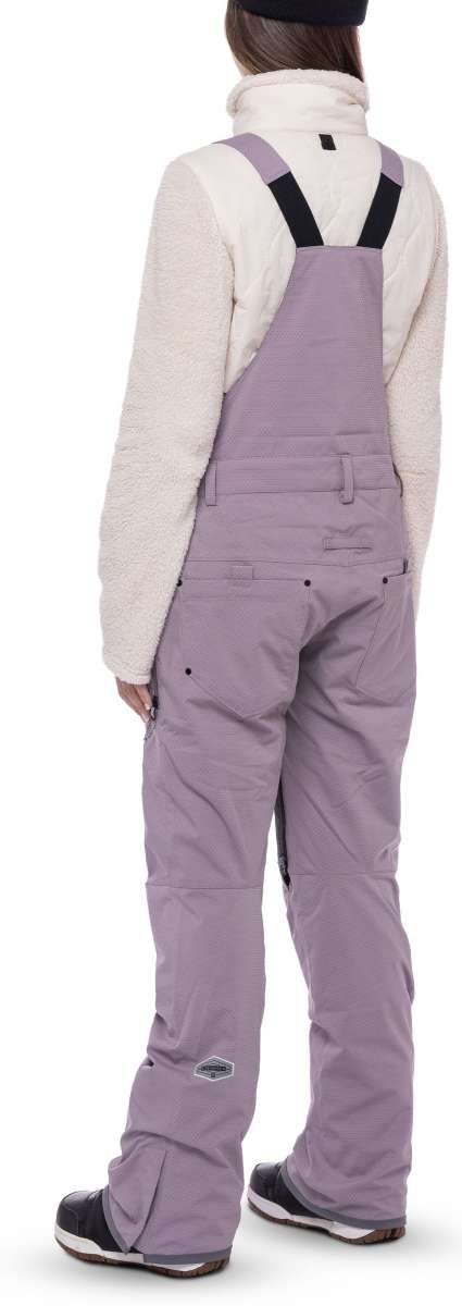 The 686 Black Magic bibs have a black quilted pattern and are fully insulated with a thick white lining.