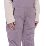 The 686 Black Magic insulated bibs are black with a white pattern.