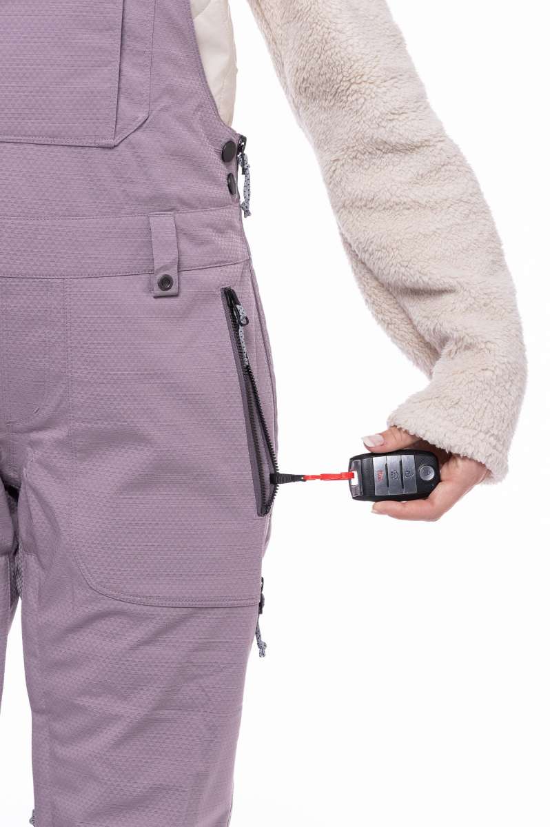 The 686 Ladies Black Magic Insulated Bib 2023 is depicted from the front view, showcasing its black color and distinctive insulated design.