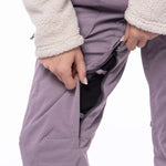 The 686 Ladies Black Magic Insulated Bib Pant is primarily black with a textured pattern on the front view.