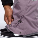 The 686 Ladies Black Magic Insulated Bib 2023 is primarily black with grey accents and has an adjustable waistband.