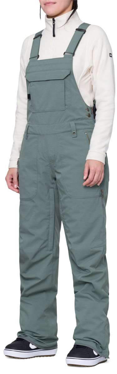 The 686 Women's Black Magic Insulated Bib 2024 is depicted in black from a front view.