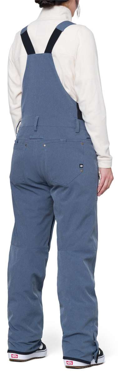 The 686 Women's Black Magic Insulated Bib features a black color with a quilted pattern and an adjustable waistband.