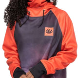 A woman wearing a grey and coral hooded sweatshirt with an orange logo on the front.