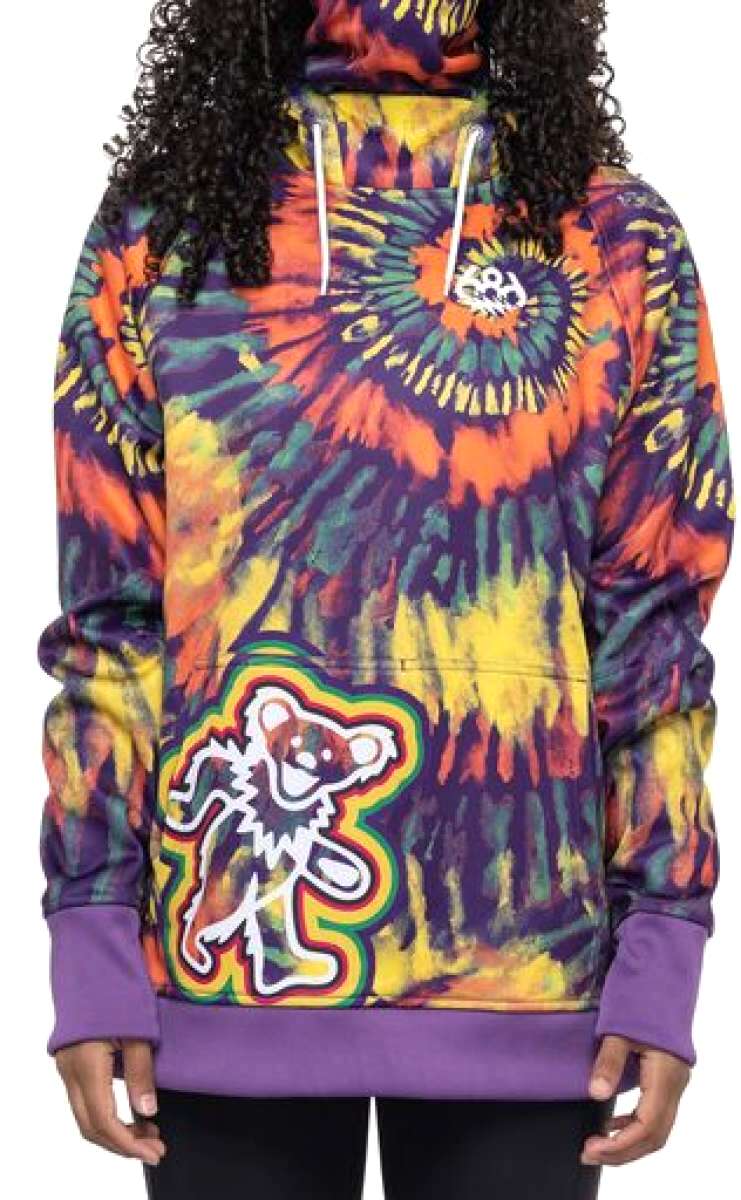 The 686 Ladies Bonded Fleece Pull Over Hoodie 2023 features an orange and purple tie-dye design with a white bear logo.