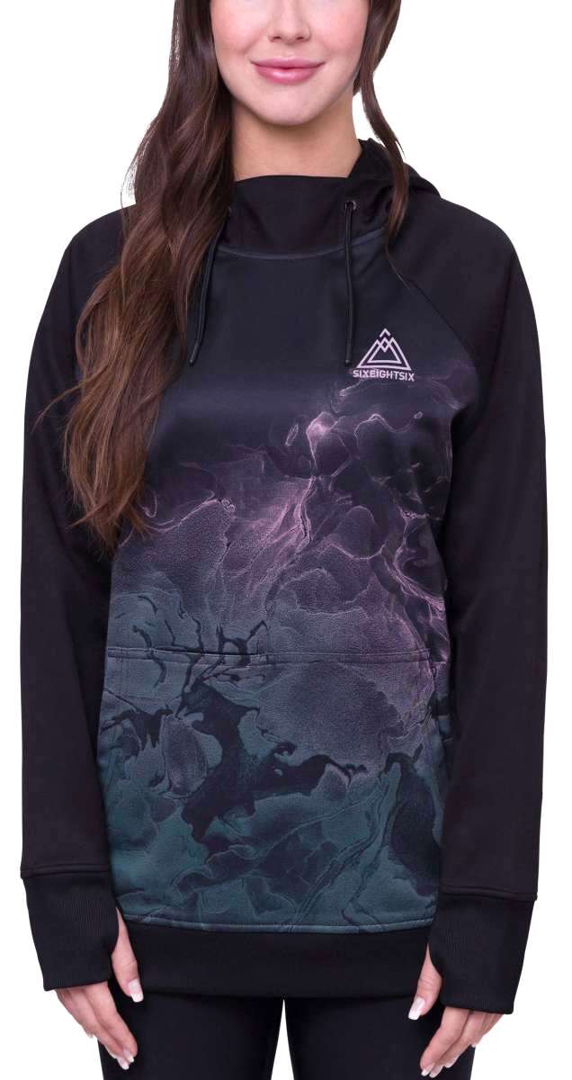 The 686 Women's Bonded Fleece Pullover Hoodie 2024 has an ombre purple and green design with a high neckline and drawstring hood.