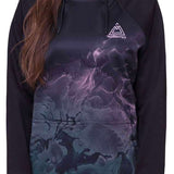 The 686 Women's Bonded Fleece Pullover Hoodie 2024 has an ombre purple and green design with a high neckline and drawstring hood.